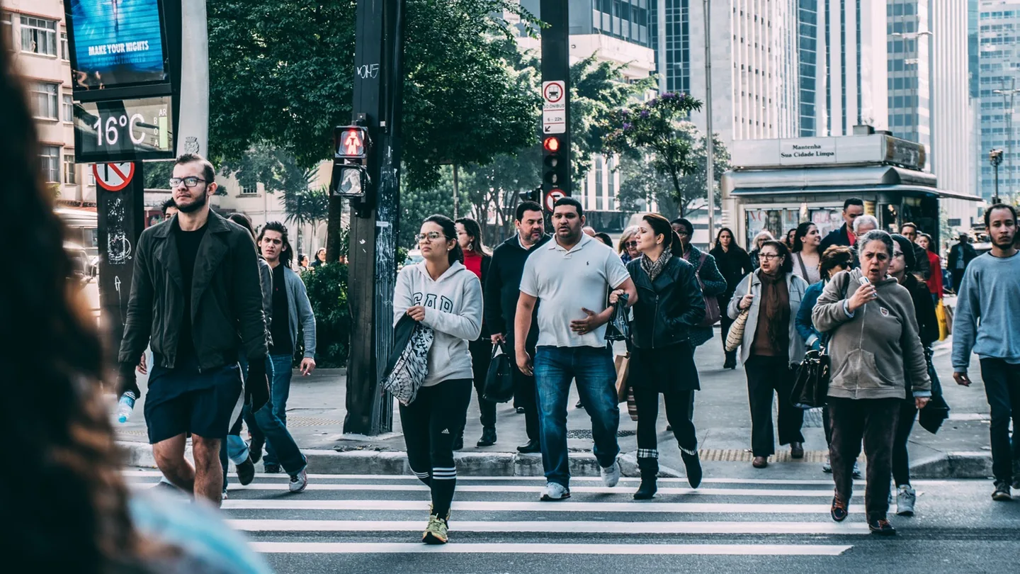 People crossing a busy city street