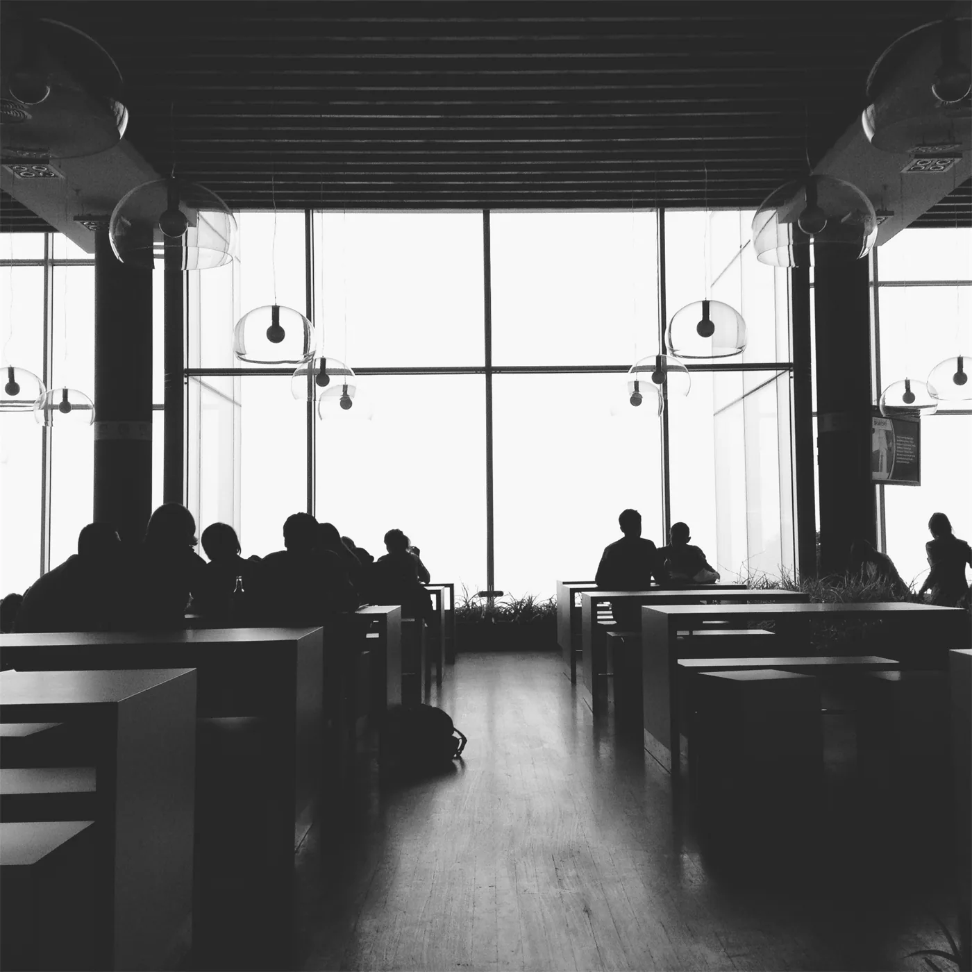 People sharing a quiet space around tables